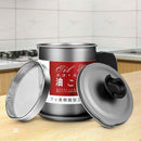 Stainless steel oil filter with red label on a kitchen counter