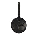 Black frying pan with four circular cooking compartments on a white background