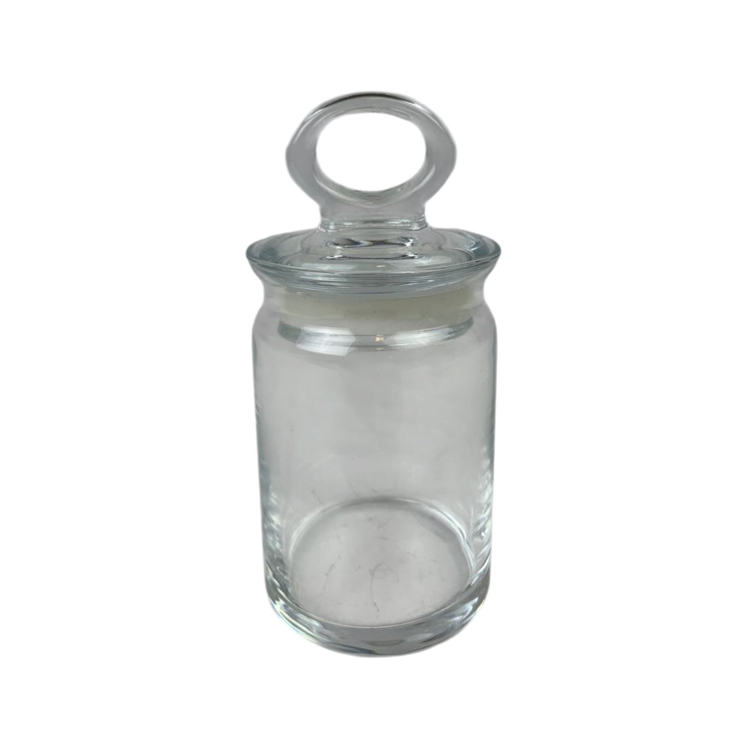 Clear glass jar with a lid on a white background