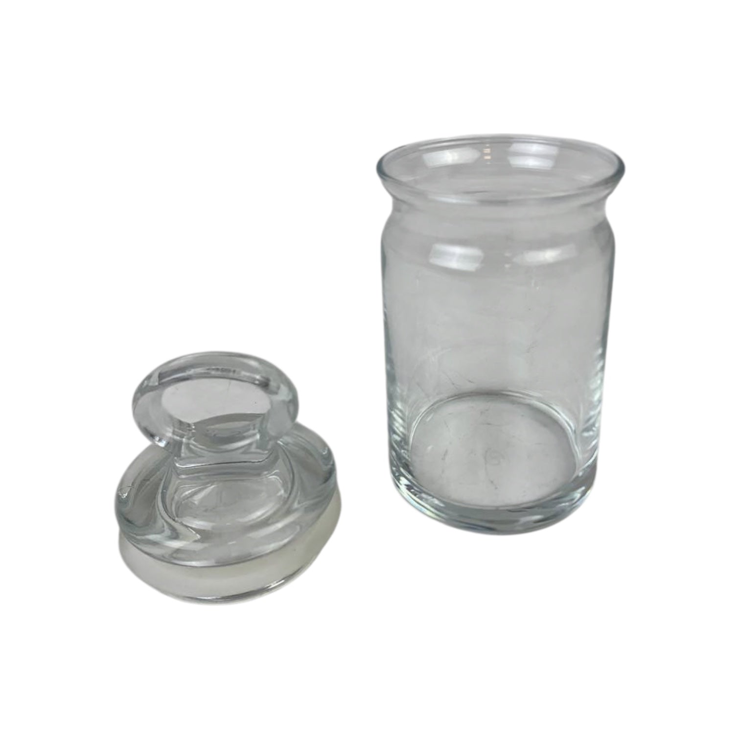 Clear glass jar with a lid on a white background