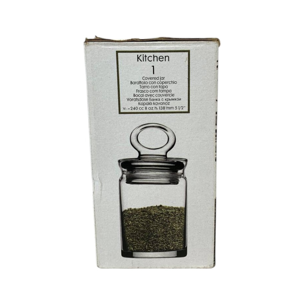 Glass jar with a lid on a white background