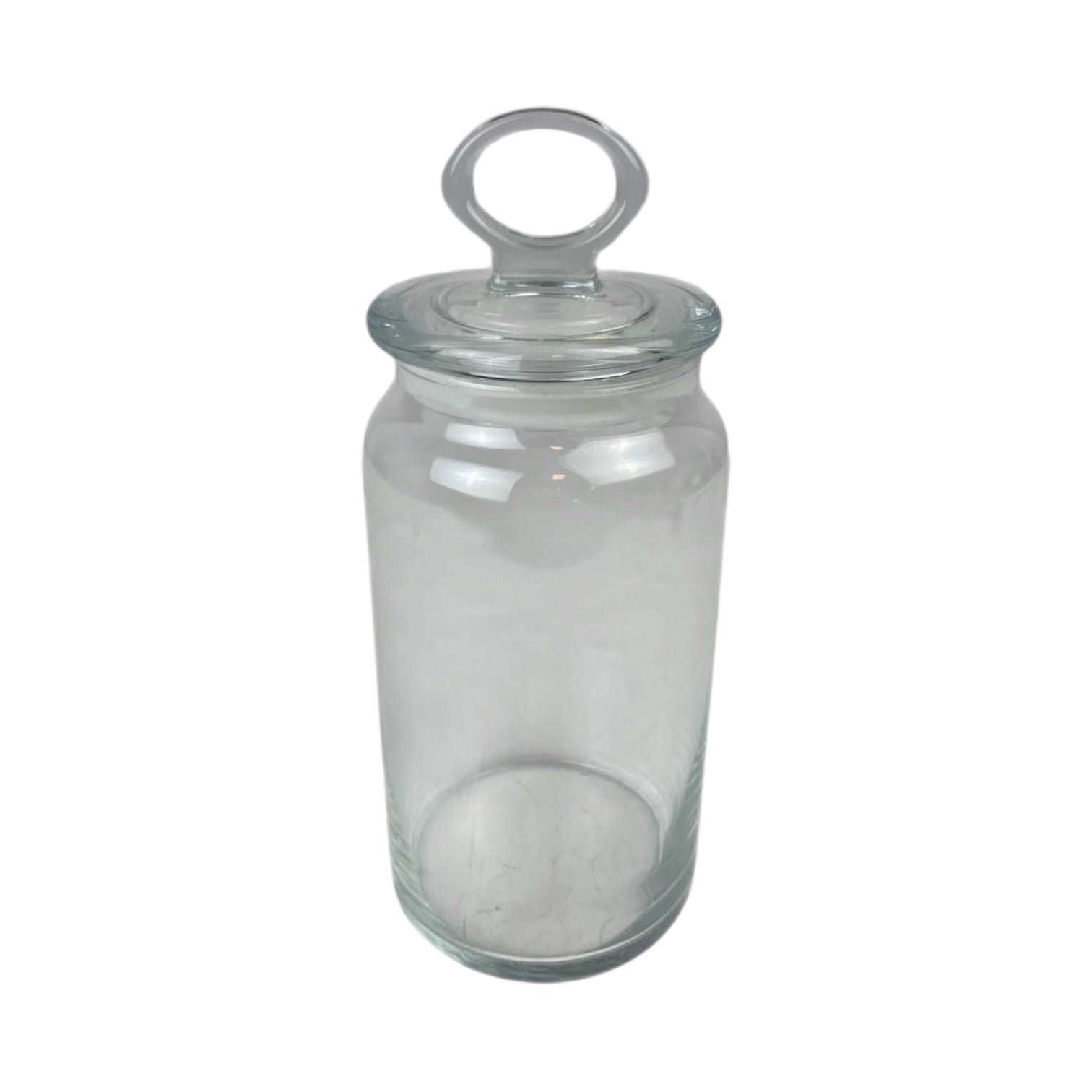 Clear glass jar with a lid on a white background