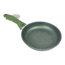Green frying pan with speckled design on a white background