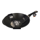 Black wok with a handle on a white background