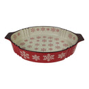 Decorative ceramic pie dish with red and white snowflake pattern on a white background