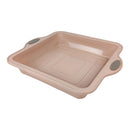 Beige baking tray with handles on a white background