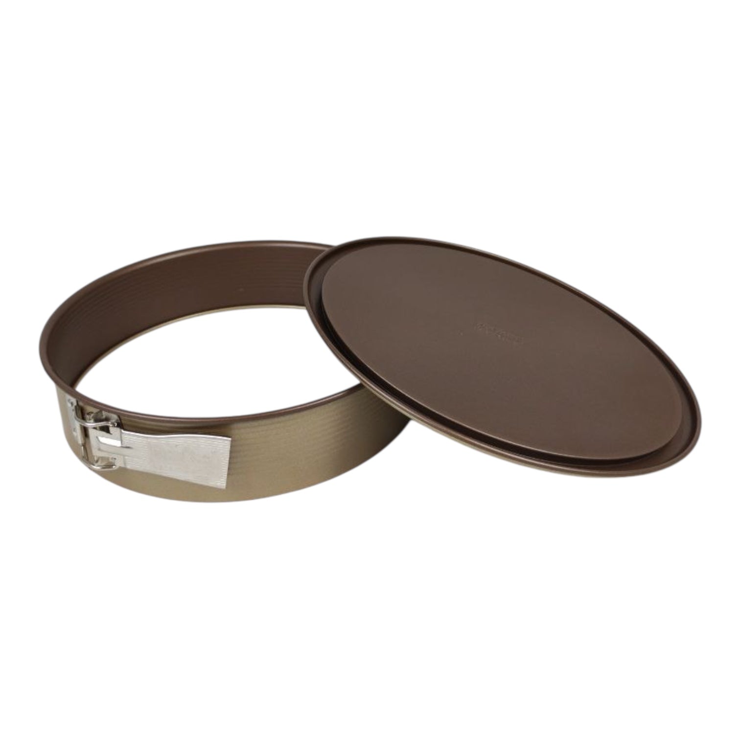Brown metal cake pan with a silver release agent on a white background