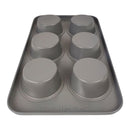 Gray silicone cupcake mold on a metal tray with visible brand name.