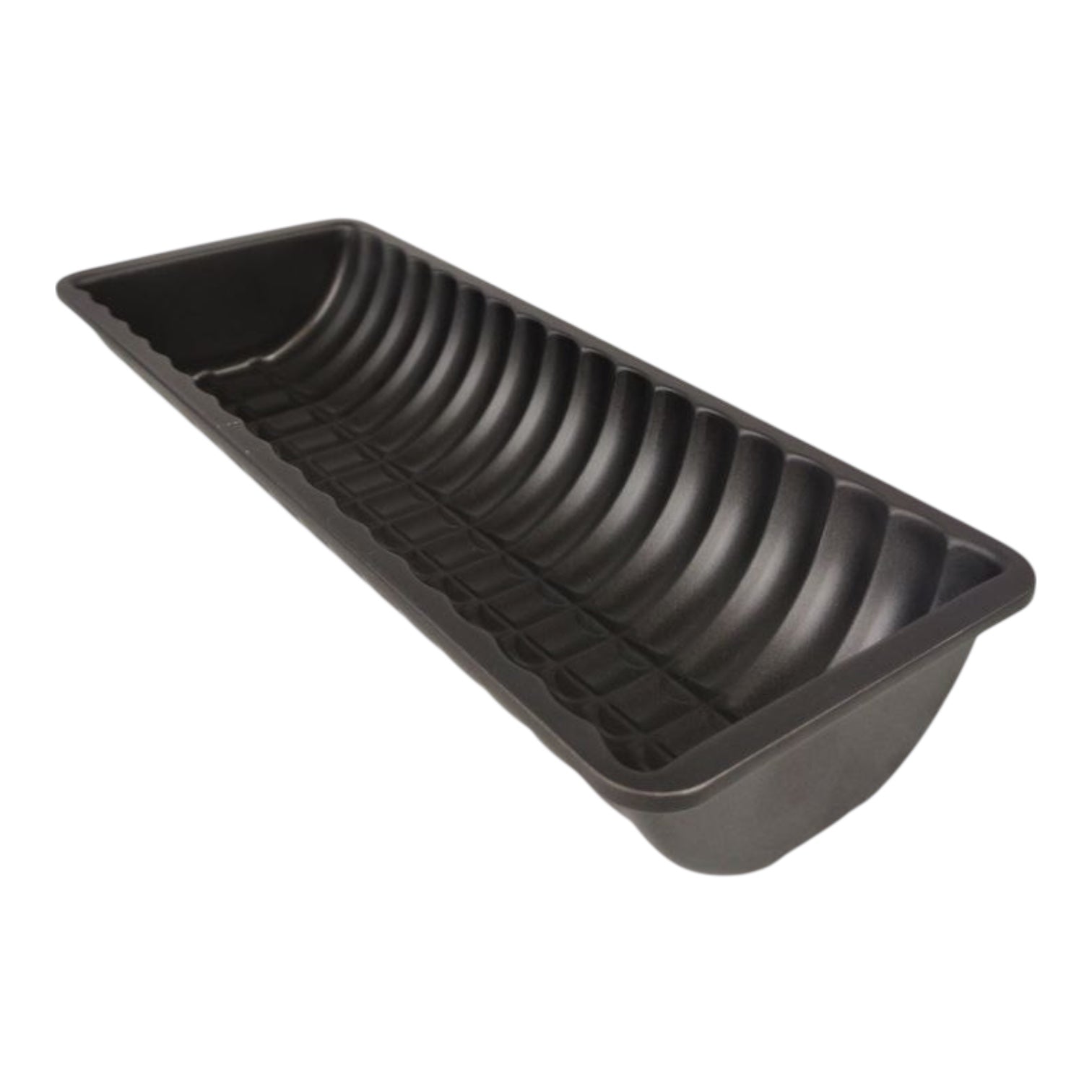 Black tray with ribbed design on a white background