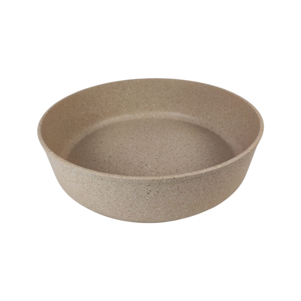 Beige ceramic bowl on a white background