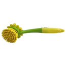 Green and yellow cleaning brush on a white background