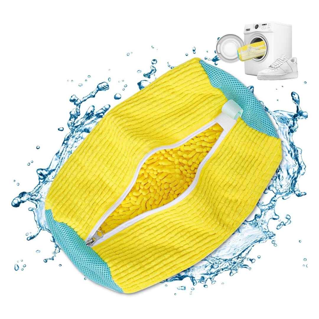 Yellow microfiber cleaning pad with blue border on a white background with water splashes.
