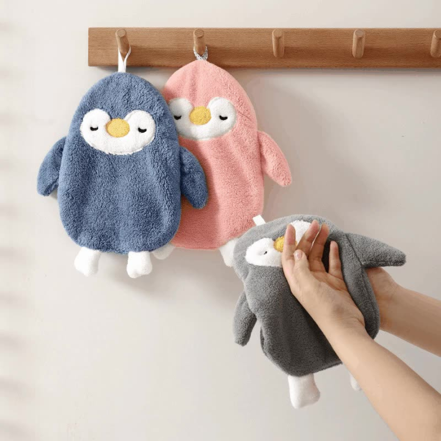 Set of Three Penguin-Shaped Bath or Cleaning Mitts in Blue, Pink, and Gray – One Being Worn on Hand – Cupindy