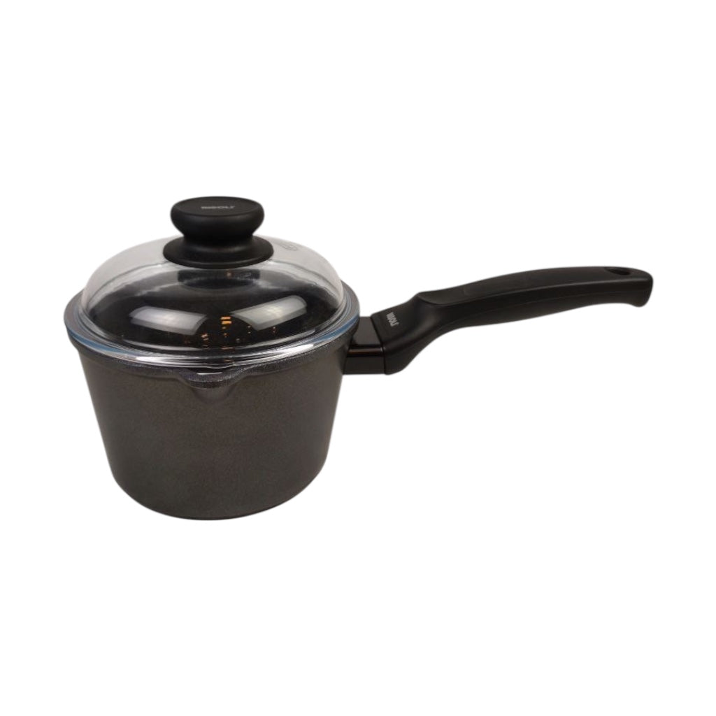 Black saucepan with a lid on a white background