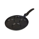Black cast iron pancake pan with four compartments on a white background