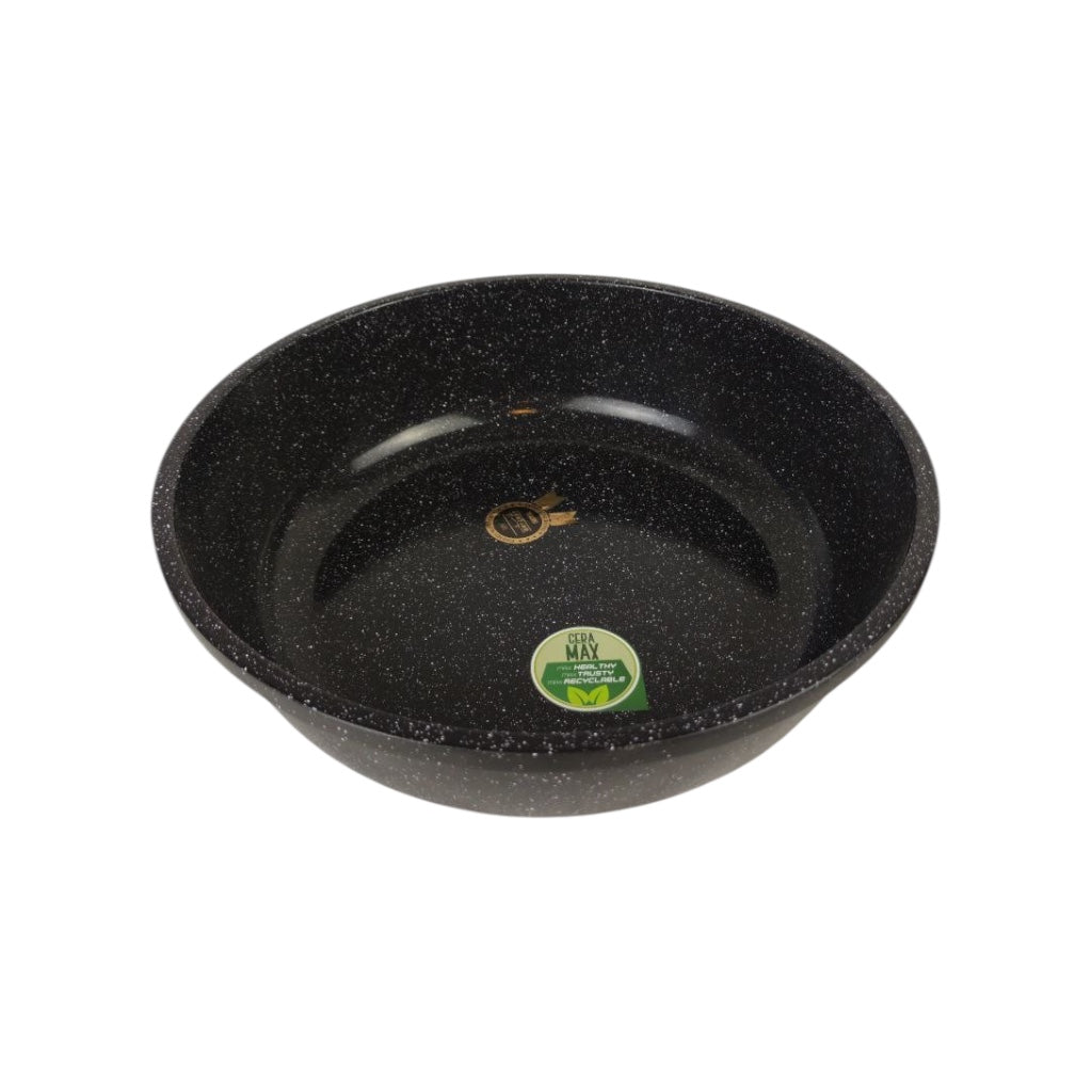 Black speckled frying pan with a green label on a white background