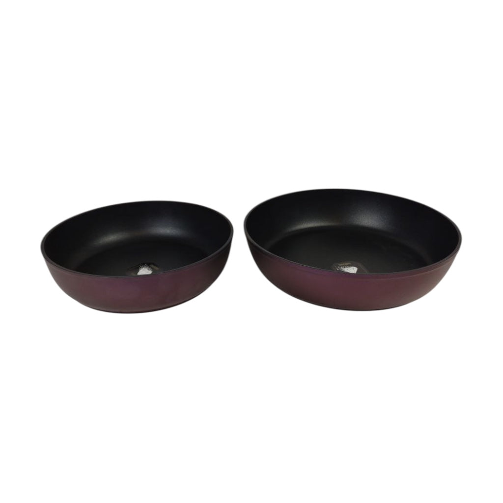 Two black bowls on a white background