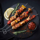 Stainless steel BBQ skewers with loop handle, perfect for grilling meat and vegetables.