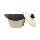 Beige pot with a black interior and beige lid on a white background