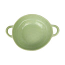Green ceramic dish with handles on a white background