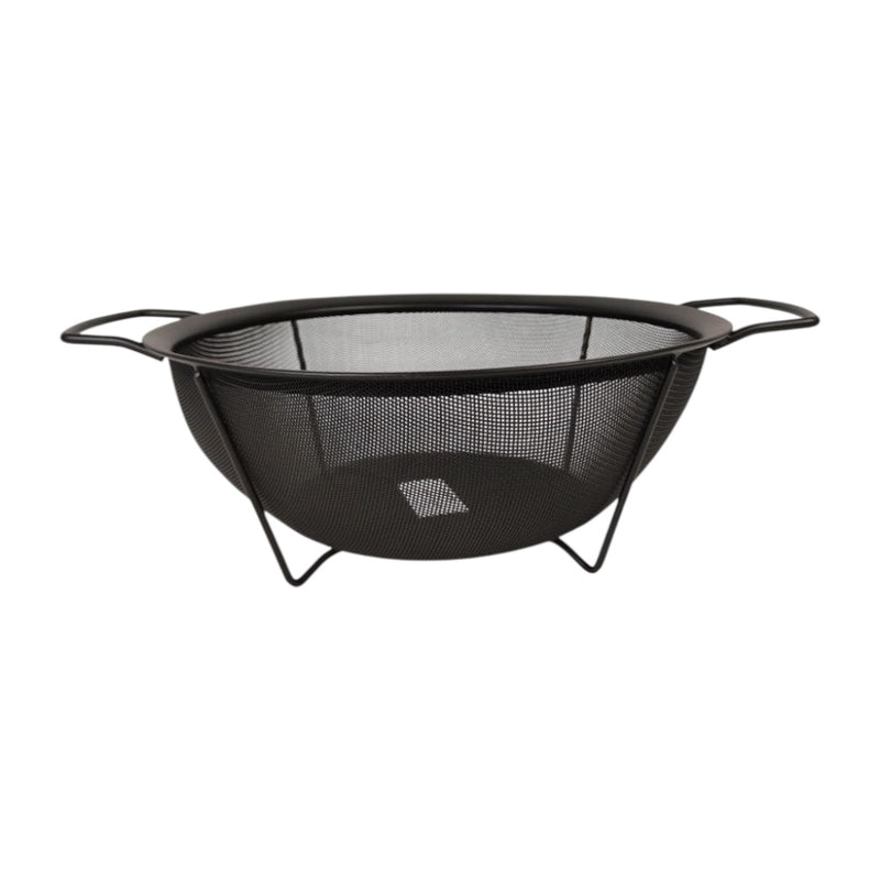 Black metal fire pit with mesh design on a white background