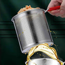 Metal strainer with food being drained over a pot of oil on a green background