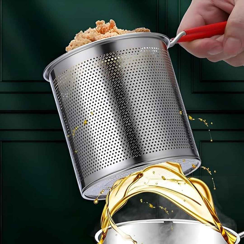 Metal strainer with food being drained over a pot of oil on a green background
