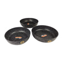 Three black speckled frying pans on a white background