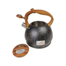 Black speckled kettle with wooden handle and lid on a white background