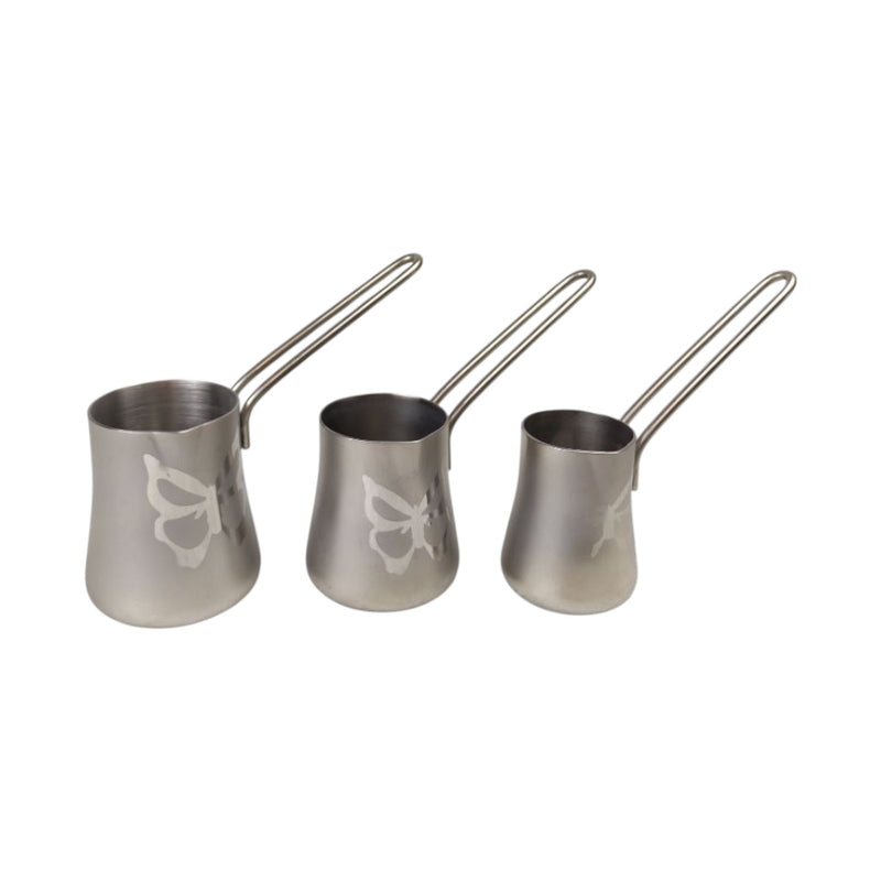 Three metallic measuring cups with handles on a white background