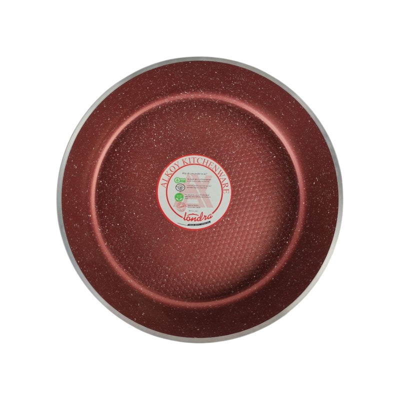 Red speckled frying pan with a brand label on a white background