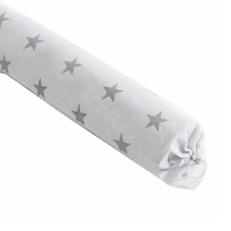 Roll of white fabric with gray star pattern on a white background