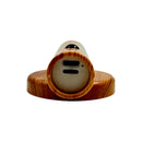 Close-up view of USB charging port and power controls on wood-finish LED night light with motion sensor and magnetic base