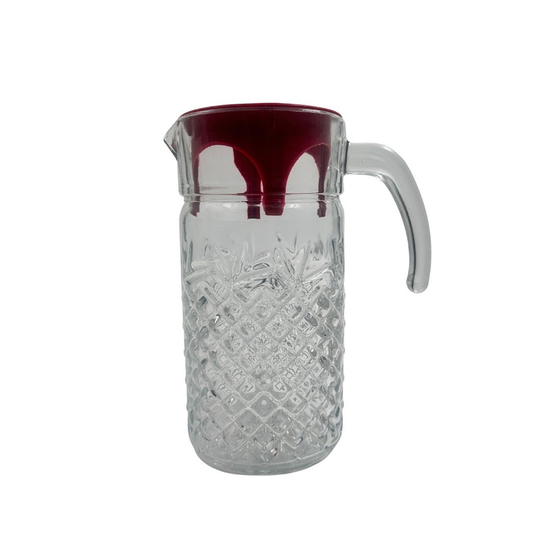 Clear glass pitcher with a red interior on a white background