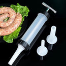 Sausage filler with three nozzles on a black background
