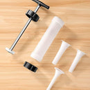 Set of white plastic components and black pump on a wooden surface