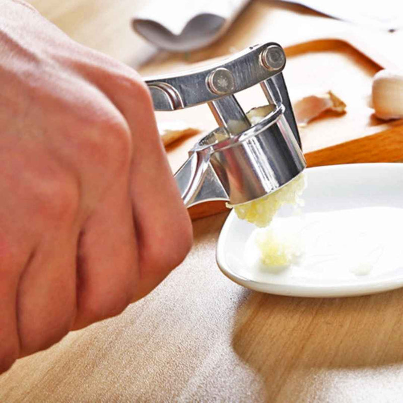 Effortless garlic presser with non-slip design and steel body | Cupindy