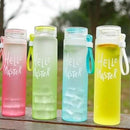 Four colorful water bottles with 'Hello Master' text on a wooden surface.