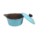 Turquoise pot with a black interior and lid on a white background