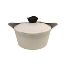 Beige pot with a black lid on a white background