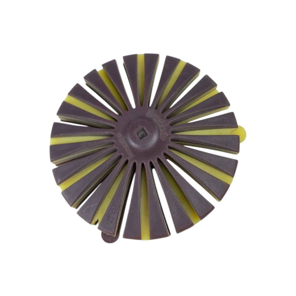 Round sanding disc with alternating brown and yellow segments on a white background