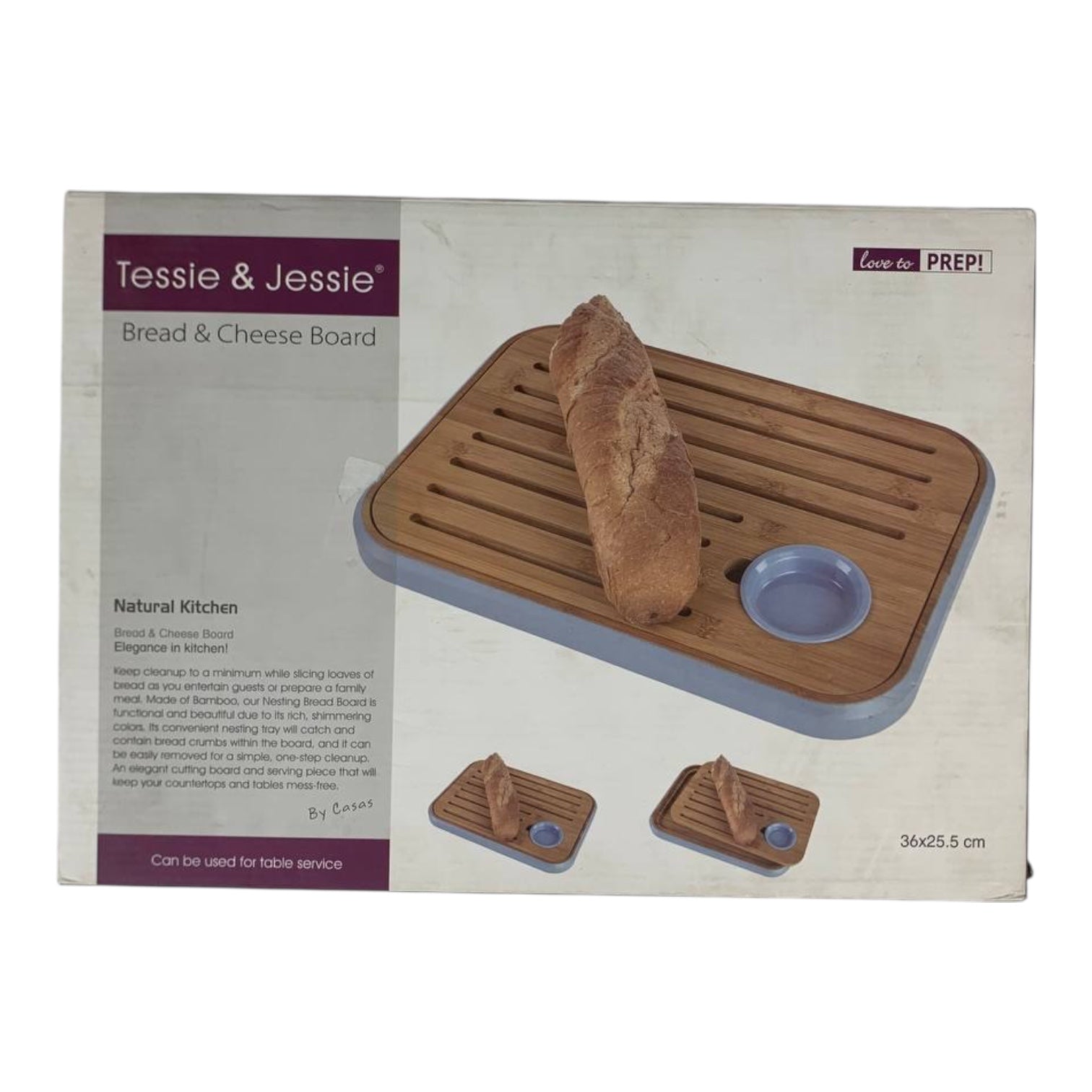 Tessie & Jessie bread and cheese board packaging with a loaf of bread on a white background