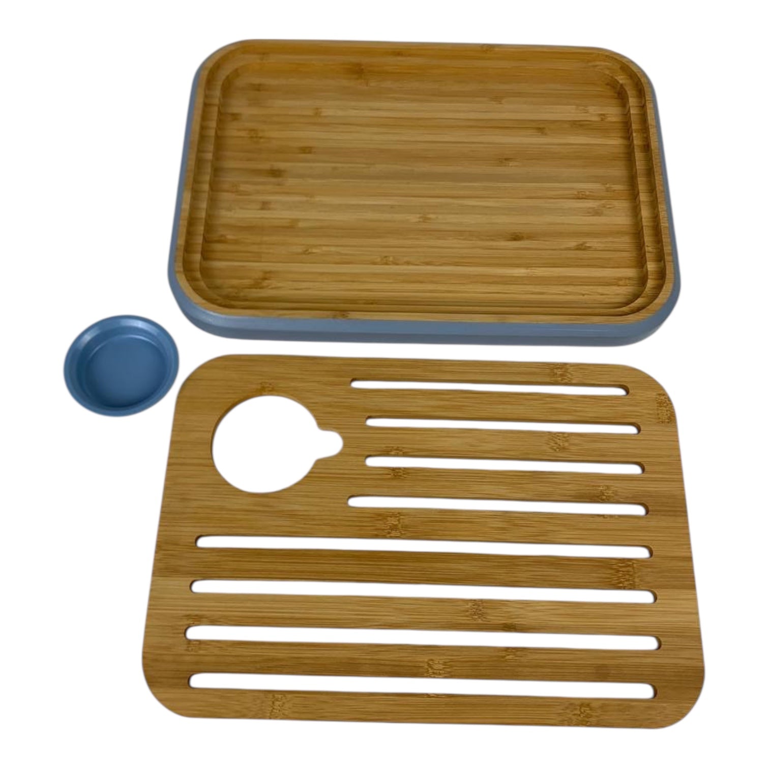 Two bamboo mats with a blue container on a white background
