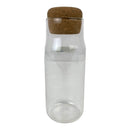 Clear glass bottle with a cork lid on a white background