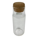Clear glass bottle with a cork lid on a white background