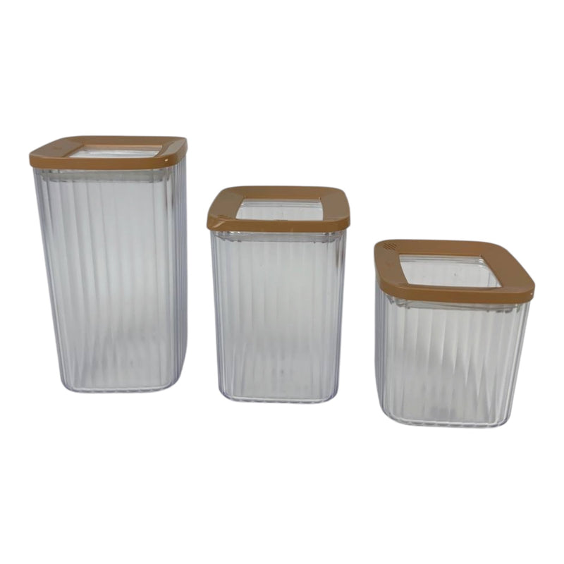 Three clear storage containers with brown lids on a white background
