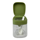 Clear container with green lid and white scoop on a white background