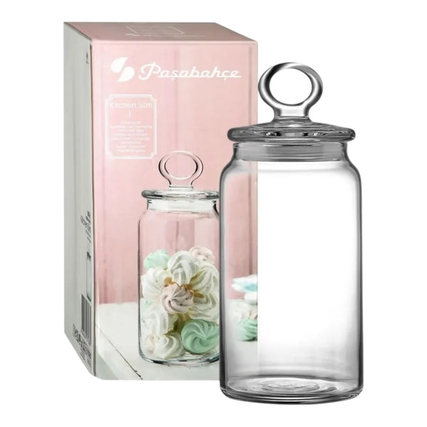Glass jar with decorative items and packaging on a white background