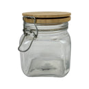 Clear glass jar with a wooden lid on a white background
