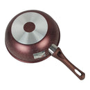 Red speckled frying pan with a silver interior on a white background